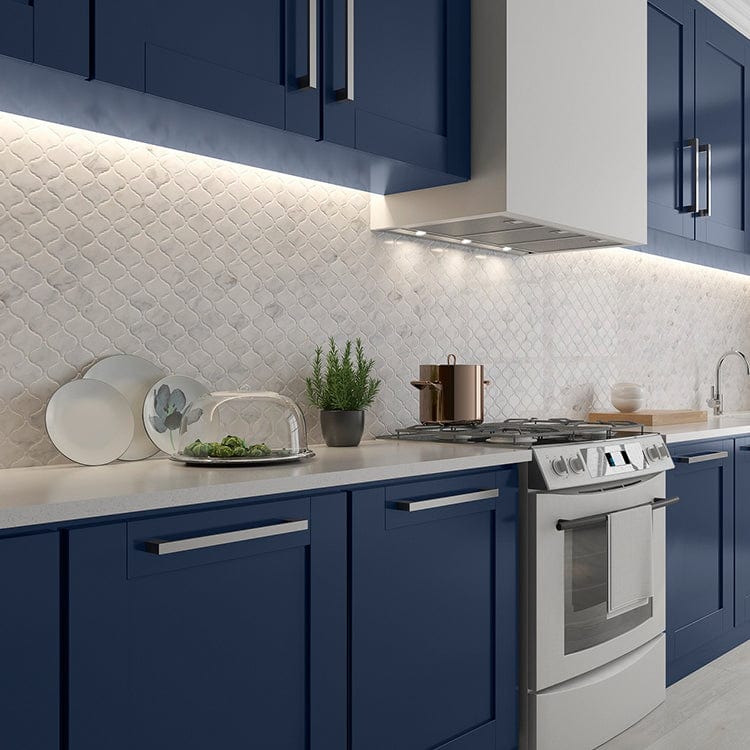 Carrara marble tile around kitchen window